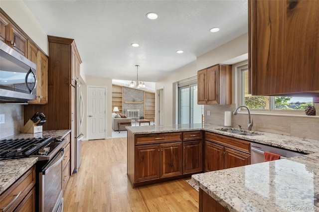 874 Mercury Cir, Lone Tree, CO 80124 - kitchen with appliances with stainless steel finishes, backsplash, light wood-style floors, and recessed lighting