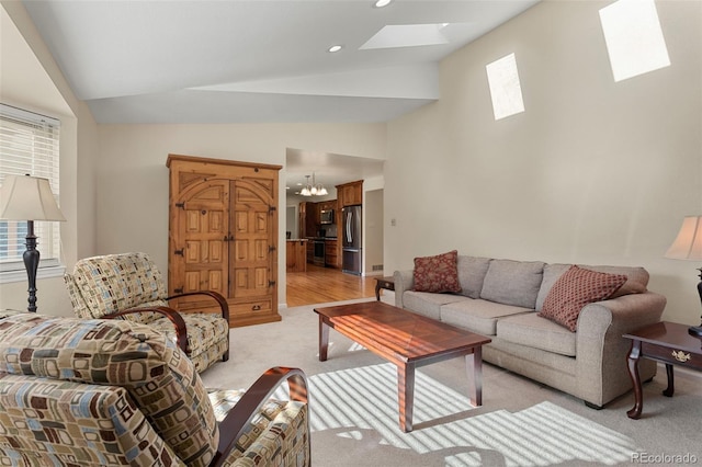 874 Mercury Cir, Lone Tree, CO 80124 - living area with a skylight, light carpet, a chandelier, recessed lighting, and high vaulted ceiling