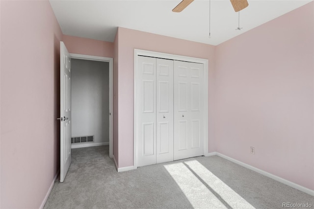 874 Mercury Cir, Lone Tree, CO 80124 - unfurnished bedroom with light colored carpet, a closet, and a ceiling fan