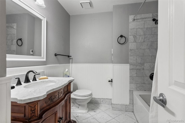 874 Mercury Cir, Lone Tree, CO 80124 - bathroom with vanity, washtub / shower combination, wainscoting, and tile patterned floors