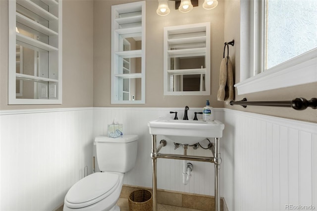874 Mercury Cir, Lone Tree, CO 80124 - bathroom with wainscoting and toilet
