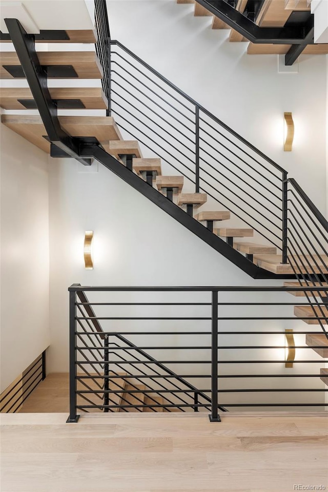 stairs with wood finished floors