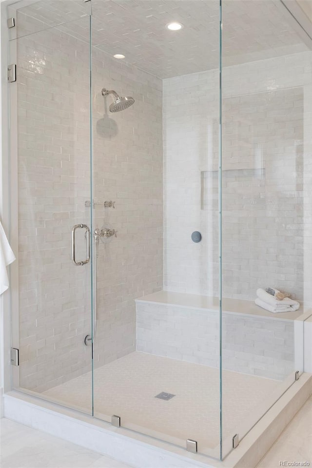 full bathroom with a shower stall