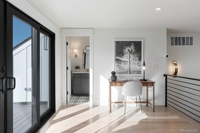 interior space featuring light wood-style floors, visible vents, and recessed lighting