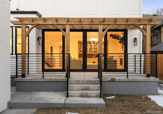 entrance to property with french doors and brick siding