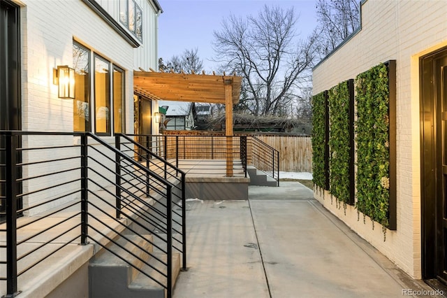 view of patio with fence and a pergola