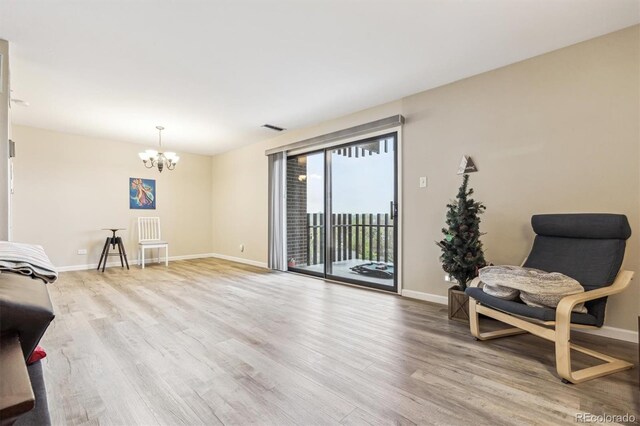 living area with wood finished floors and baseboards