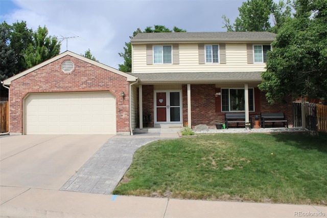 7394 S Field Ct, Littleton, CO 80128 - traditional-style house with an attached garage, concrete driveway, and brick siding