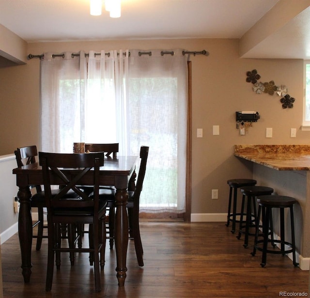 7394 S Field Ct, Littleton, CO 80128 - dining space with dark wood-type flooring and baseboards