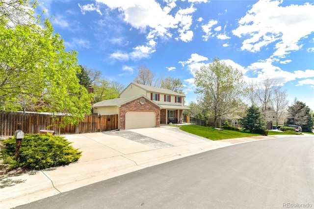 7394 S Field Ct, Littleton, CO 80128 - traditional-style house featuring brick siding, concrete driveway, and an attached garage