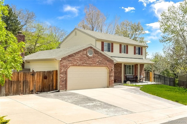 7394 S Field Ct, Littleton, CO 80128 - traditional home featuring brick siding, concrete driveway, covered porch, a garage, and a shingled roof