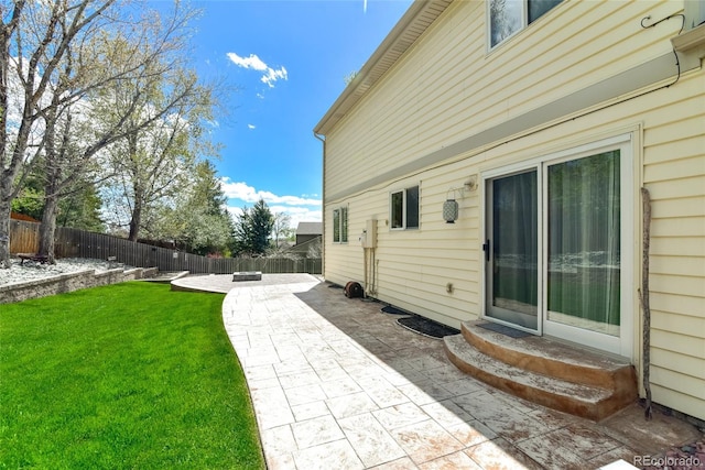 7394 S Field Ct, Littleton, CO 80128 - fenced backyard featuring entry steps and a patio