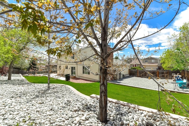 7394 S Field Ct, Littleton, CO 80128 - rear view of house featuring a fenced backyard and a patio area