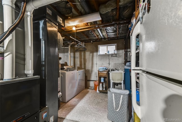 7394 S Field Ct, Littleton, CO 80128 - basement featuring freestanding refrigerator and washing machine and dryer