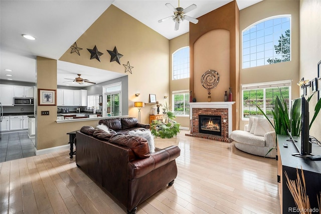 5774 S Genoa Ct, Aurora, CO 80015 - living area with a ceiling fan, a towering ceiling, healthy amount of natural light, and recessed lighting