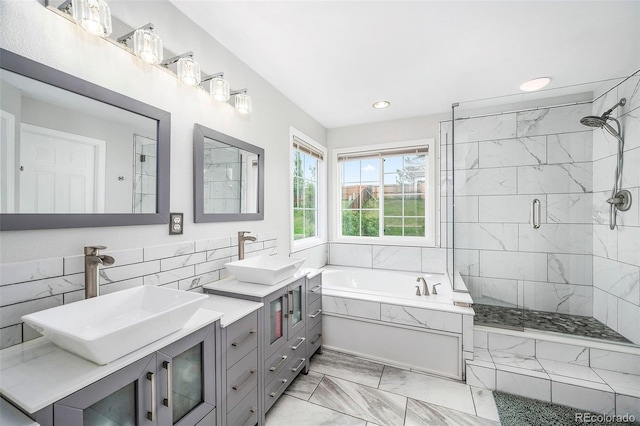 5774 S Genoa Ct, Aurora, CO 80015 - full bath with a garden tub, double vanity, marble finish floors, a stall shower, and recessed lighting