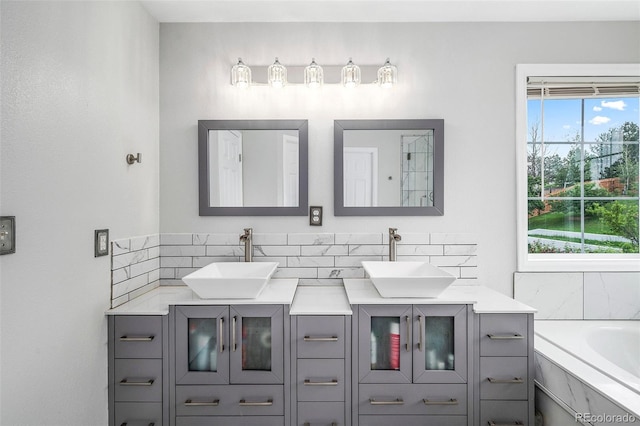 5774 S Genoa Ct, Aurora, CO 80015 - bathroom with double vanity and a tub to relax in