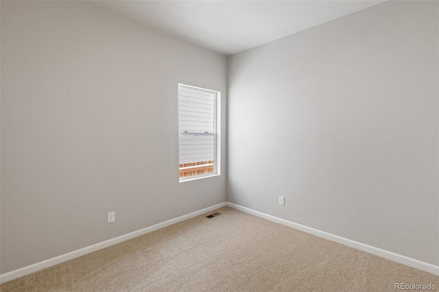 spare room featuring carpet floors