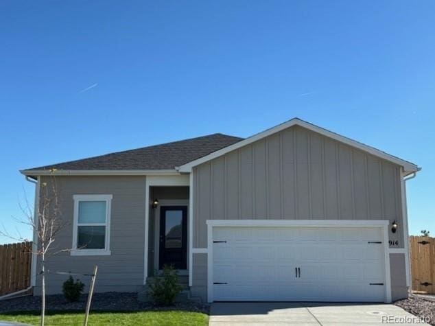 ranch-style house featuring a garage