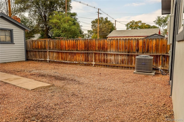 view of yard with central air condition unit