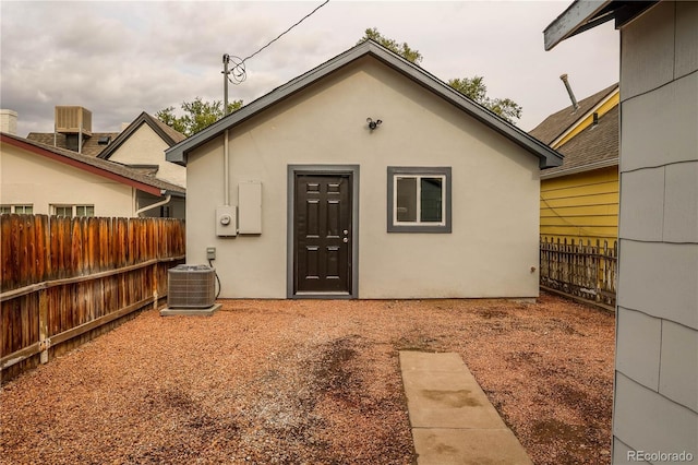 1511 E Routt St Ave, Pueblo, CO 81004 - back of property featuring central air condition unit, a fenced backyard, and stucco siding