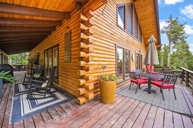 1673 Sinton Rd, Evergreen, CO 80439 - wooden deck featuring outdoor dining area