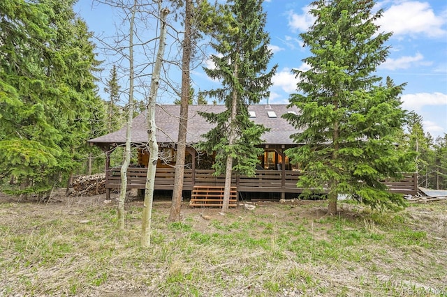 1673 Sinton Rd, Evergreen, CO 80439 - rear view of house featuring roof with shingles and a wooden deck