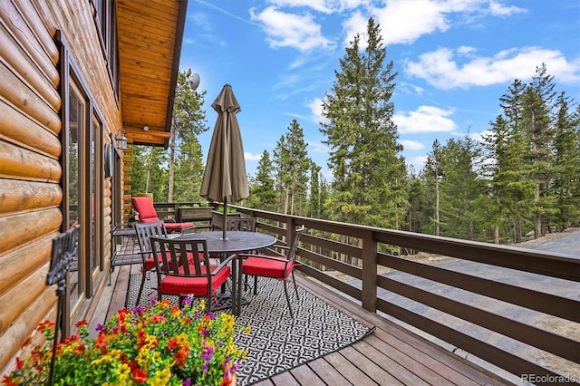 1673 Sinton Rd, Evergreen, CO 80439 - wooden deck with outdoor dining space