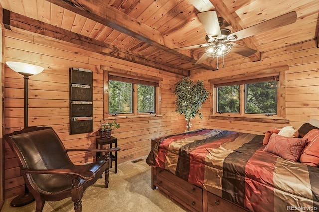 1673 Sinton Rd, Evergreen, CO 80439 - carpeted bedroom featuring wooden ceiling with exposed beams, wooden walls, and multiple windows