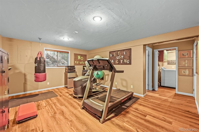 1673 Sinton Rd, Evergreen, CO 80439 - exercise room with baseboards, wood finished floors, and a textured ceiling