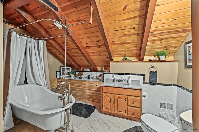 1673 Sinton Rd, Evergreen, CO 80439 - full bath with wooden ceiling, toilet, a freestanding tub, marble finish flooring, and vanity