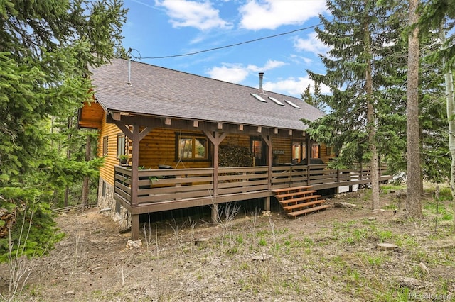 1673 Sinton Rd, Evergreen, CO 80439 - back of property featuring roof with shingles, log veneer siding, and a deck