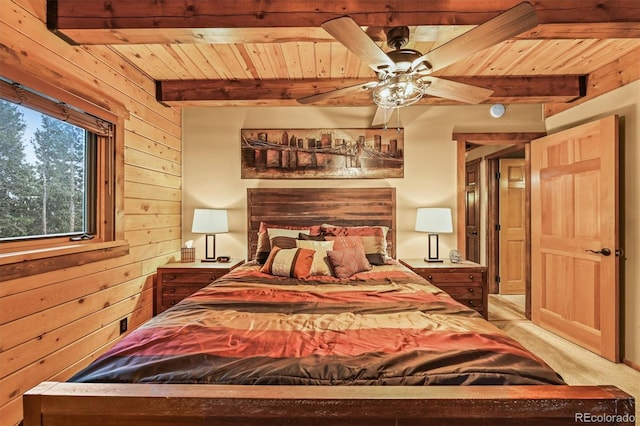 1673 Sinton Rd, Evergreen, CO 80439 - carpeted bedroom featuring wood walls and wood ceiling with exposed beams