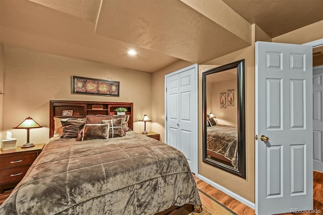 1673 Sinton Rd, Evergreen, CO 80439 - bedroom featuring wood finished floors, baseboards, recessed lighting, and a closet