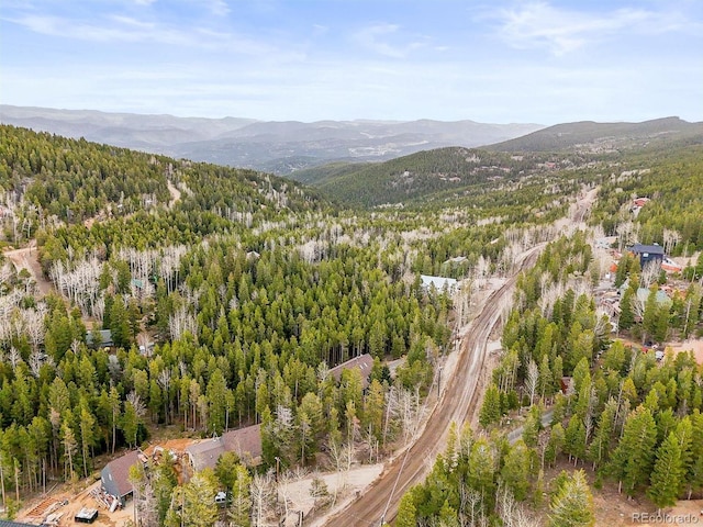 1673 Sinton Rd, Evergreen, CO 80439 - aerial overview of property's location with mountains and a heavily wooded area