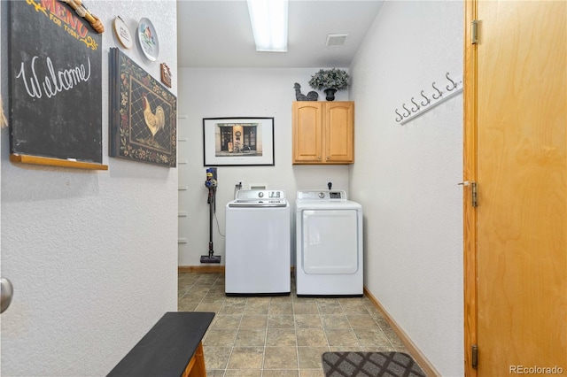 washroom with cabinets and separate washer and dryer