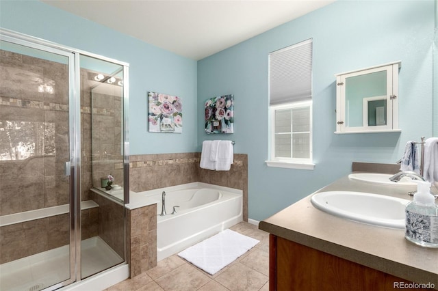 1038 Mircos St, Erie, CO 80516 - bathroom with tile patterned floors, a bath, double vanity, and a stall shower