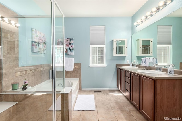 1038 Mircos St, Erie, CO 80516 - full bath featuring a bath, double vanity, tile patterned flooring, and a tile shower