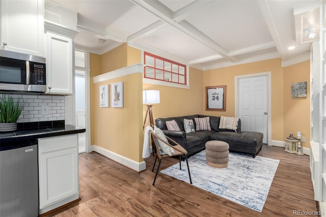 1038 Mircos St, Erie, CO 80516 - living room with coffered ceiling, wood finished floors, beam ceiling, and crown molding