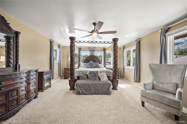 bedroom with light carpet and ceiling fan