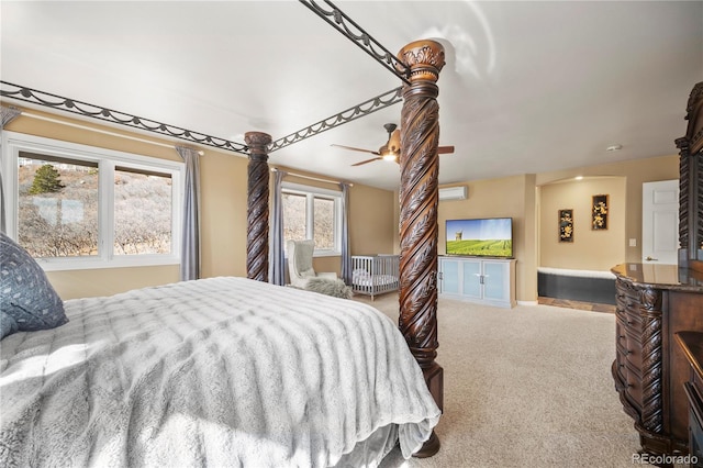 bedroom featuring a wall mounted AC and light carpet