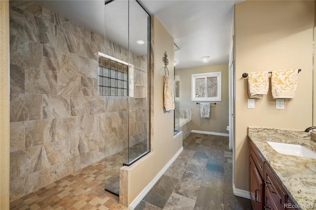 full bathroom featuring vanity, shower with separate bathtub, and toilet