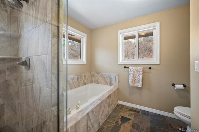 bathroom with toilet and shower with separate bathtub