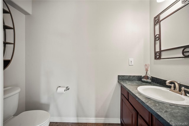 bathroom featuring vanity and toilet