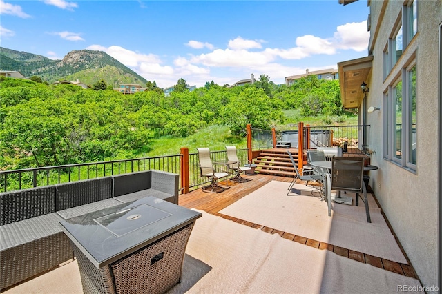 3325 Blodgett, Colorado Springs, CO 80919 - view of patio with outdoor dining area, a deck with mountain view, and outdoor lounge area