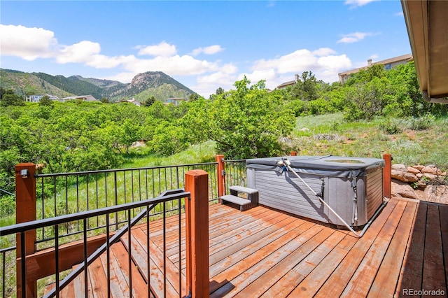 3325 Blodgett, Colorado Springs, CO 80919 - wooden deck featuring a hot tub and a mountain view