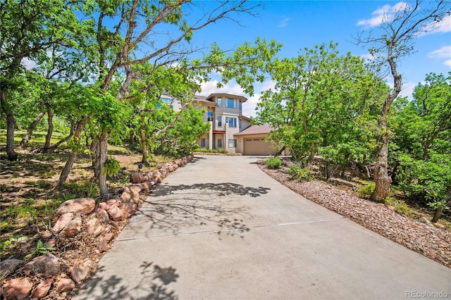 3325 Blodgett, Colorado Springs, CO 80919 - view of front of property with driveway, a garage, and stucco siding