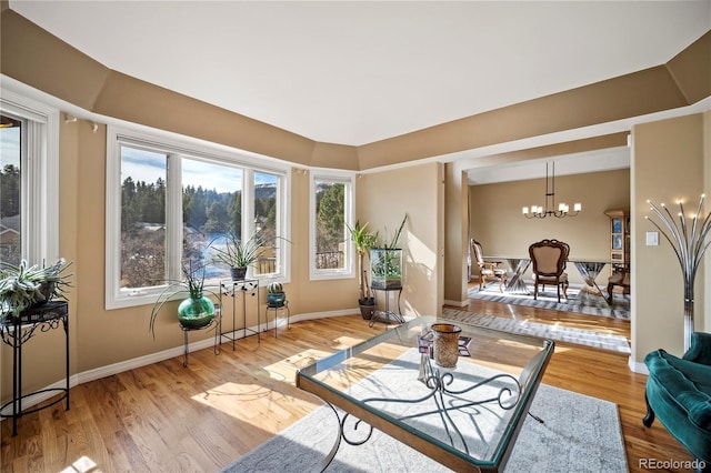3325 Blodgett, Colorado Springs, CO 80919 - living area featuring a chandelier and light wood-style flooring