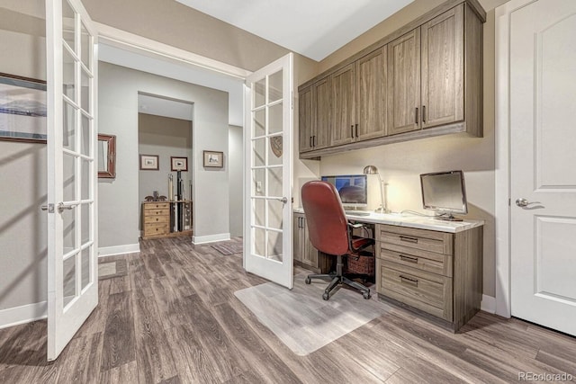 788 Alumroot St, Castle Rock, CO 80104 - office area featuring french doors, wood finished floors, and baseboards