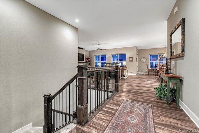 788 Alumroot St, Castle Rock, CO 80104 - corridor with an upstairs landing, wood finished floors, baseboards, a chandelier, and a textured wall